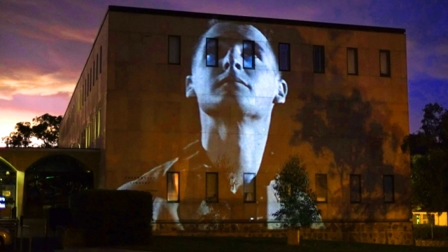 Photograph of a projection onto an ANU building