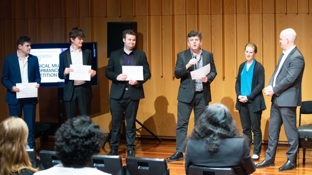 Image: 2023 competition winners and panel members. L-R: Second Prize - Thomas Hallworth (voice), Third Prize & Llewellyn Choir Prize for Most Outstanding Instrumentalist - James Monron (Cello), First Prize & People's Choice Prize - Connor Whyte (guitar), panel members - Scott Davie, Lucy Carrigy-Ryan and Patrick Suthers. Photo by Yun Hu/ANU